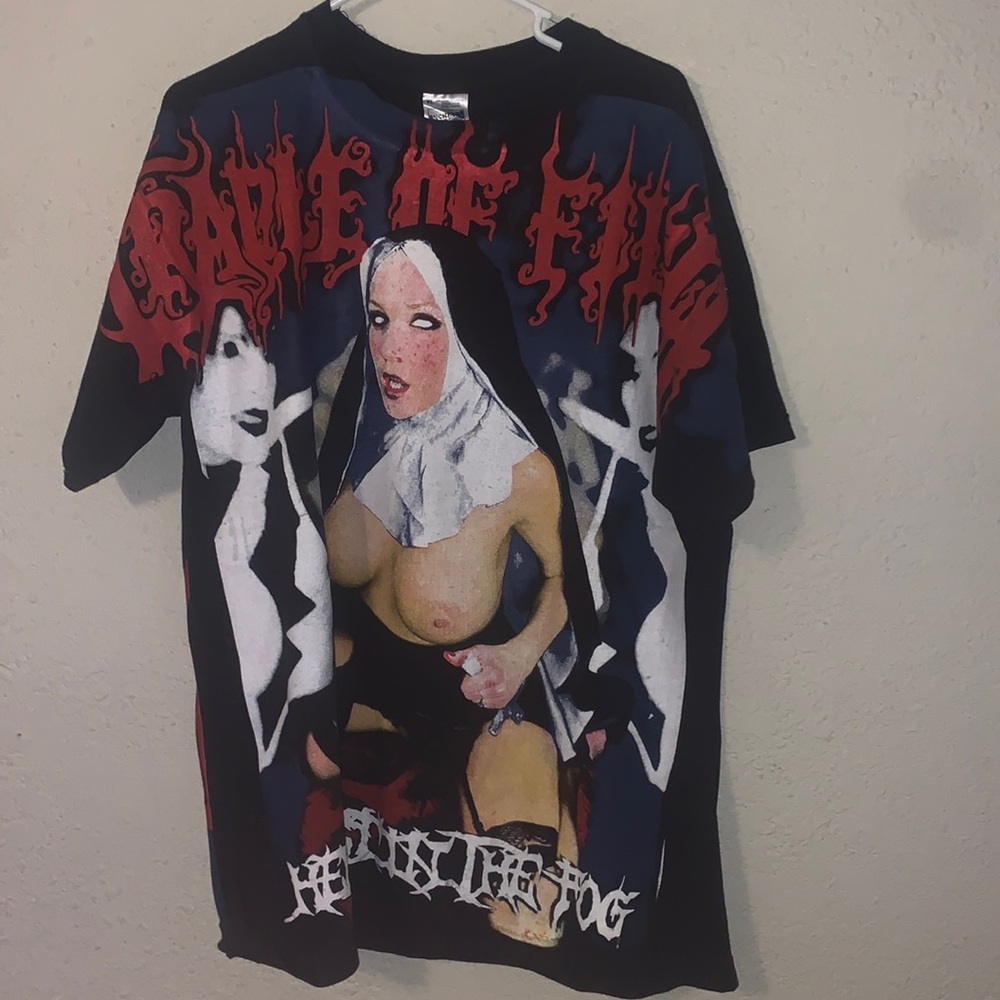 “Naked nun” not sure what any context behind this shirt is.